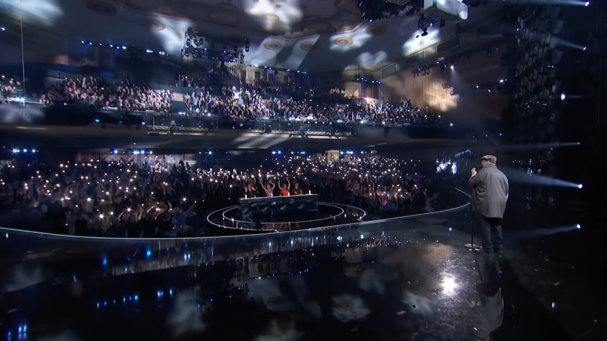 Crowd lights up the room as Richard Goodall sings 'Faithfully' in the